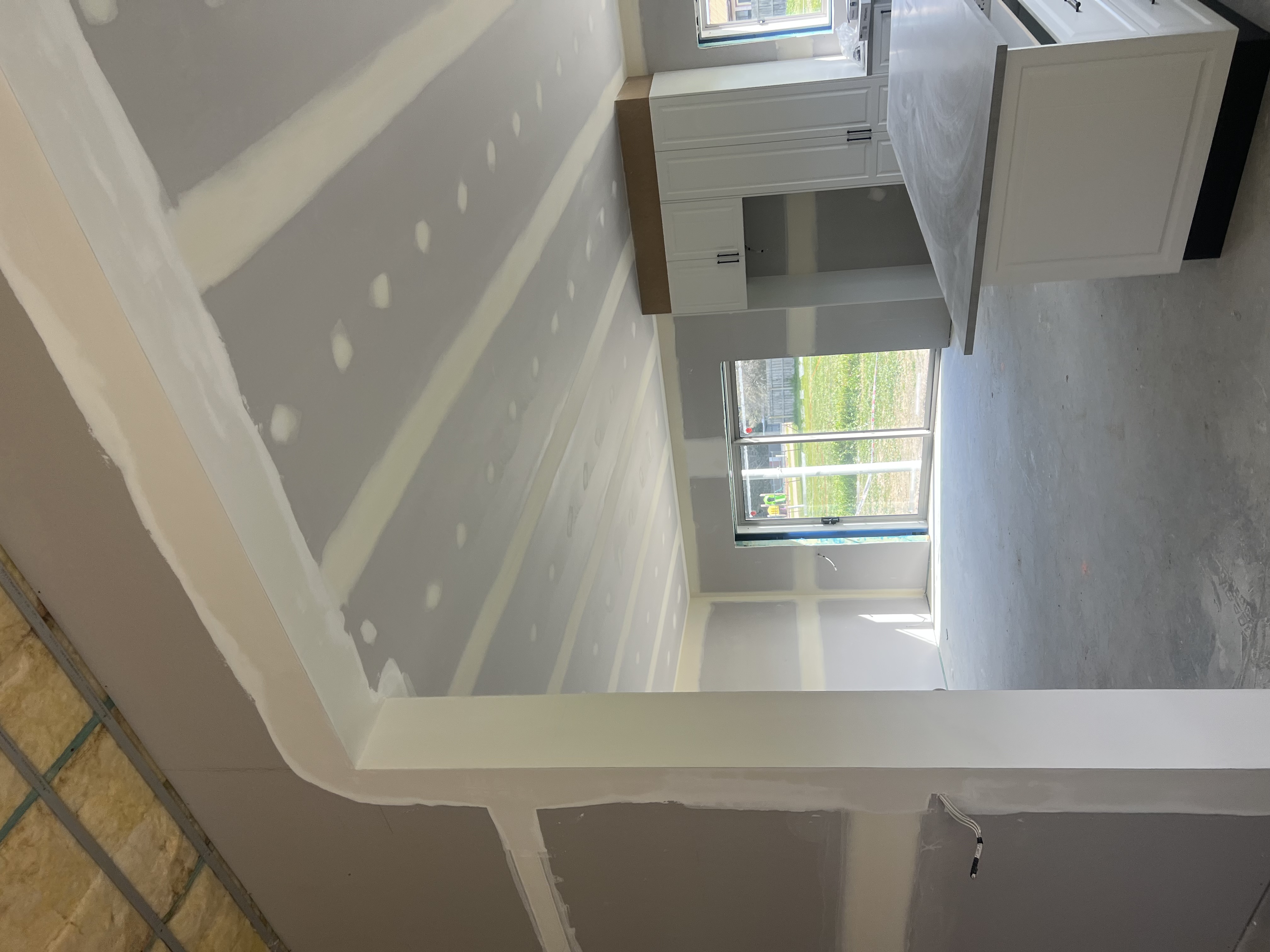 Freshly plastered residential room ready for paint