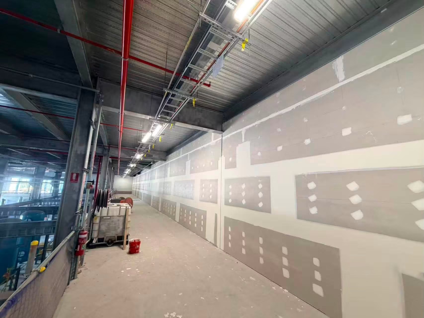 Commercial corridor plastering with ceiling insulation