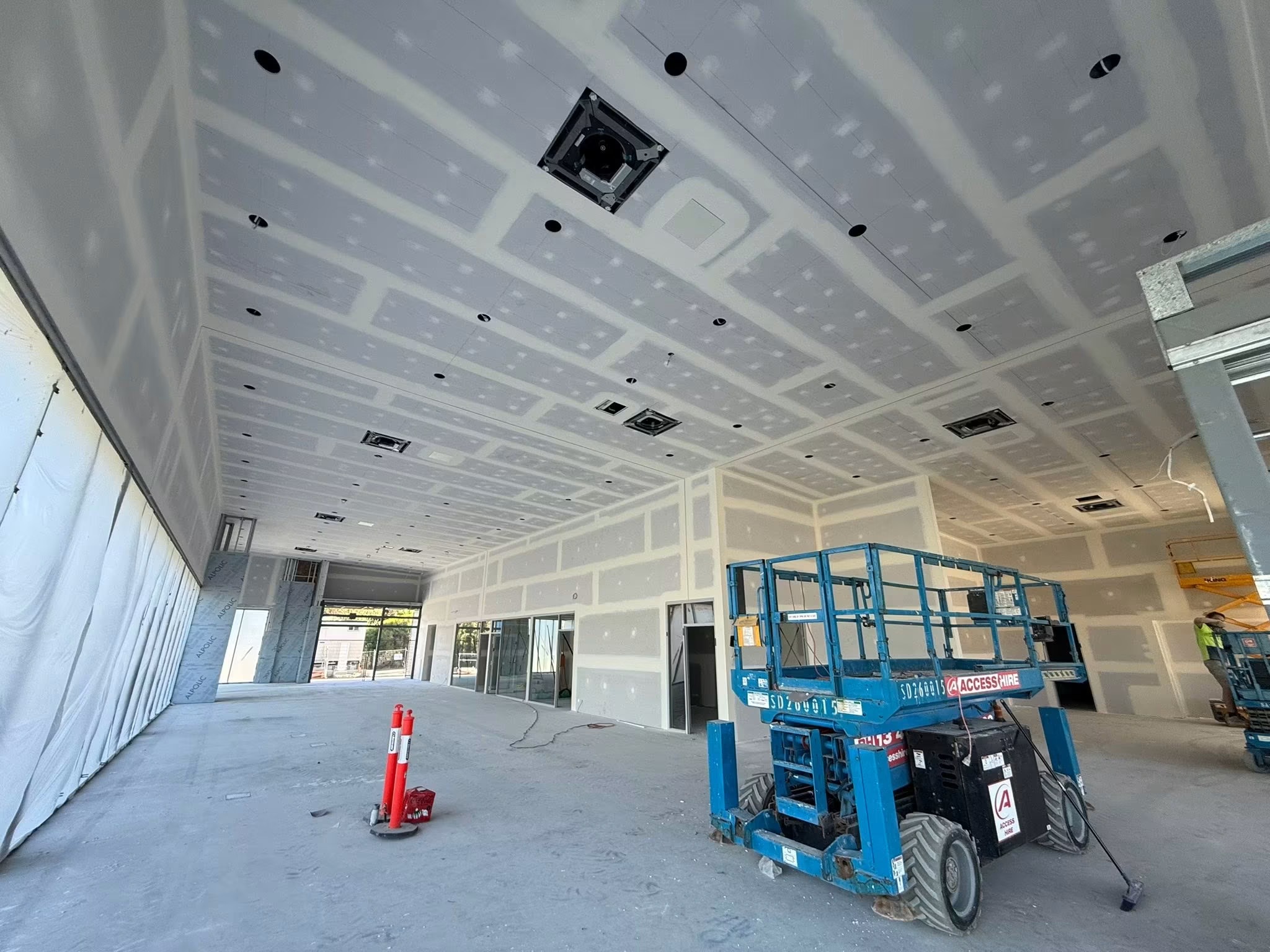 Commercial fitout plastering with scissor lift